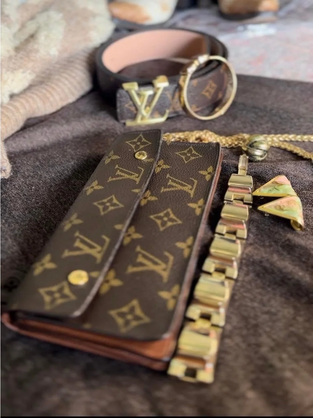 Louis Vuitton Monogram Canvas Accordion Clutch in Brown with Gold Accents